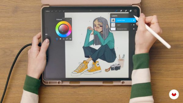 Top down view of Magdalina Dianova drawing a girl with yellow converse in Procreate.